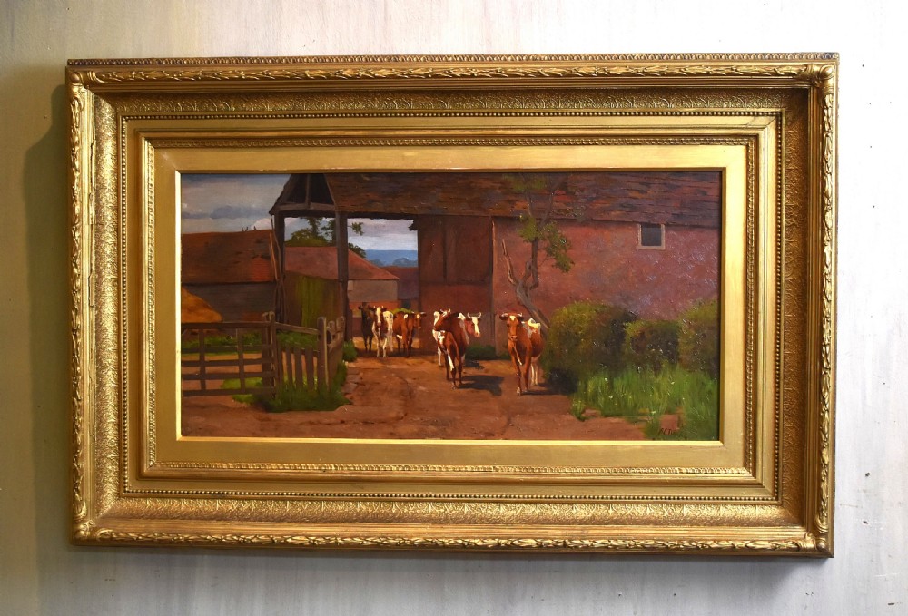 An oil painting depicting a herd of cattle entering a farmyard barn, presented within a wide gilded wooden frame.