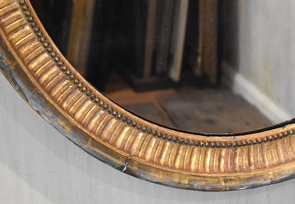 Large early nineteenth century oval gilt mirror View IV
