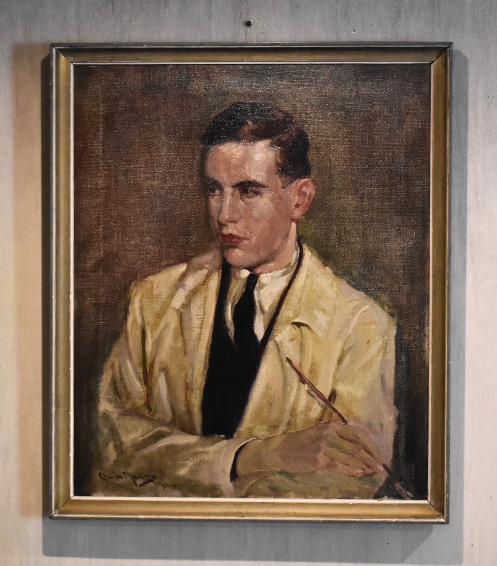 A framed oil painting on canvas depicting a young male artist holding a paintbrush, wearing a cream jacket and dark tie against a muted brown background.