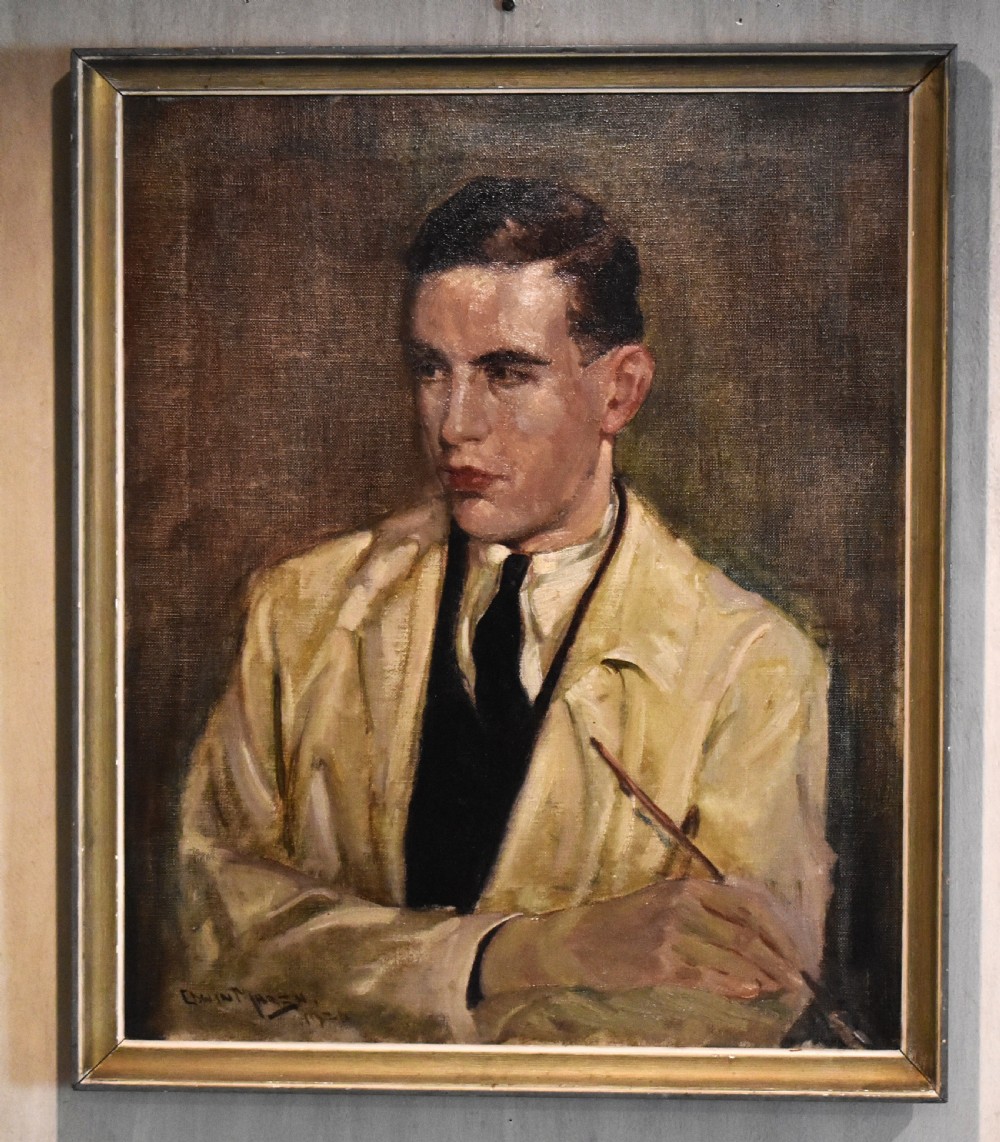 A framed oil painting on canvas depicting a young male artist holding a paintbrush, wearing a cream jacket and dark tie against a muted brown background. View II