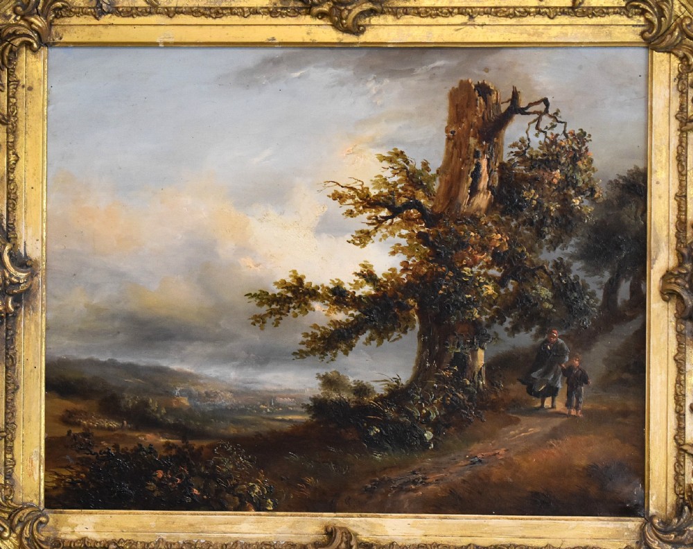 A nineteenth-century French oil painting depicting figures beside a prominent oak tree in a atmospheric rural landscape, presented in a ornate gilded gesso frame. View III