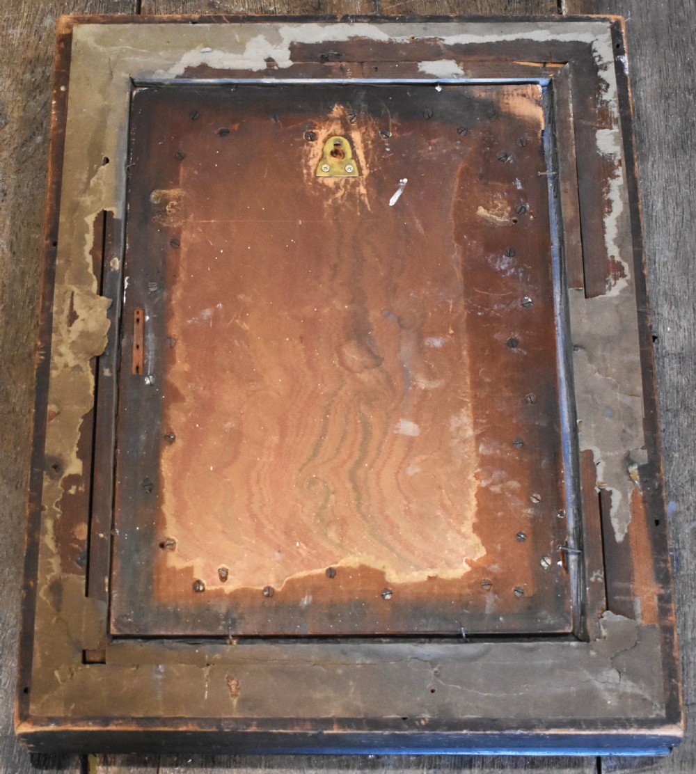 An Arts and Crafts relief plaque depicting a multi-winged angel in hammered silvered metal, set within a multi-tiered ebonised and oak frame. View VI