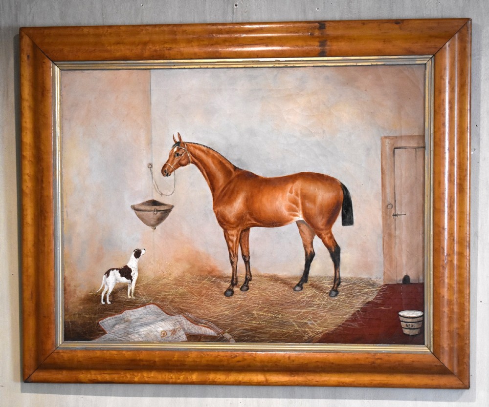 An antique oil painting depicting a chestnut horse and a small dog inside a stable setting, presented in a polished timber frame with a gold inner slip. View II