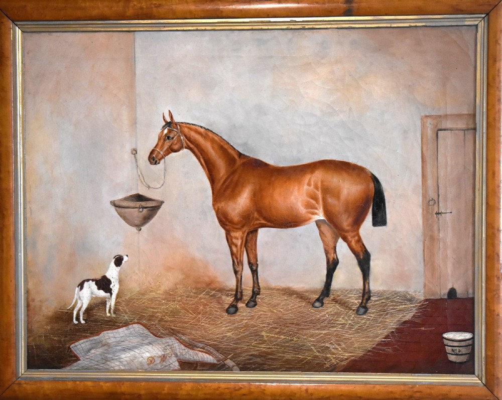An antique oil painting depicting a chestnut horse and a small dog inside a stable setting, presented in a polished timber frame with a gold inner slip. View III