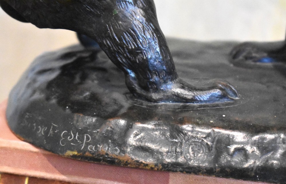 A dark patinated bronze sculpture depicting two play-fighting bear cubs standing on an integral naturalistic bronze base. View V