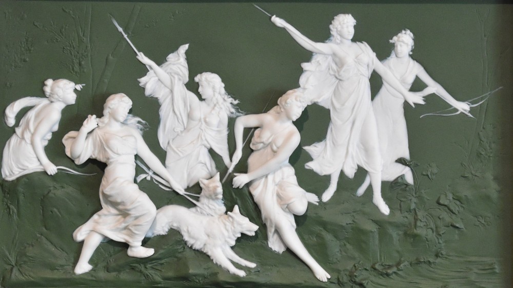 A pair of framed Art Nouveau Dresden porcelain plaques featuring white high-relief mythological figures on a dark green ground within reeded black frames. View IV