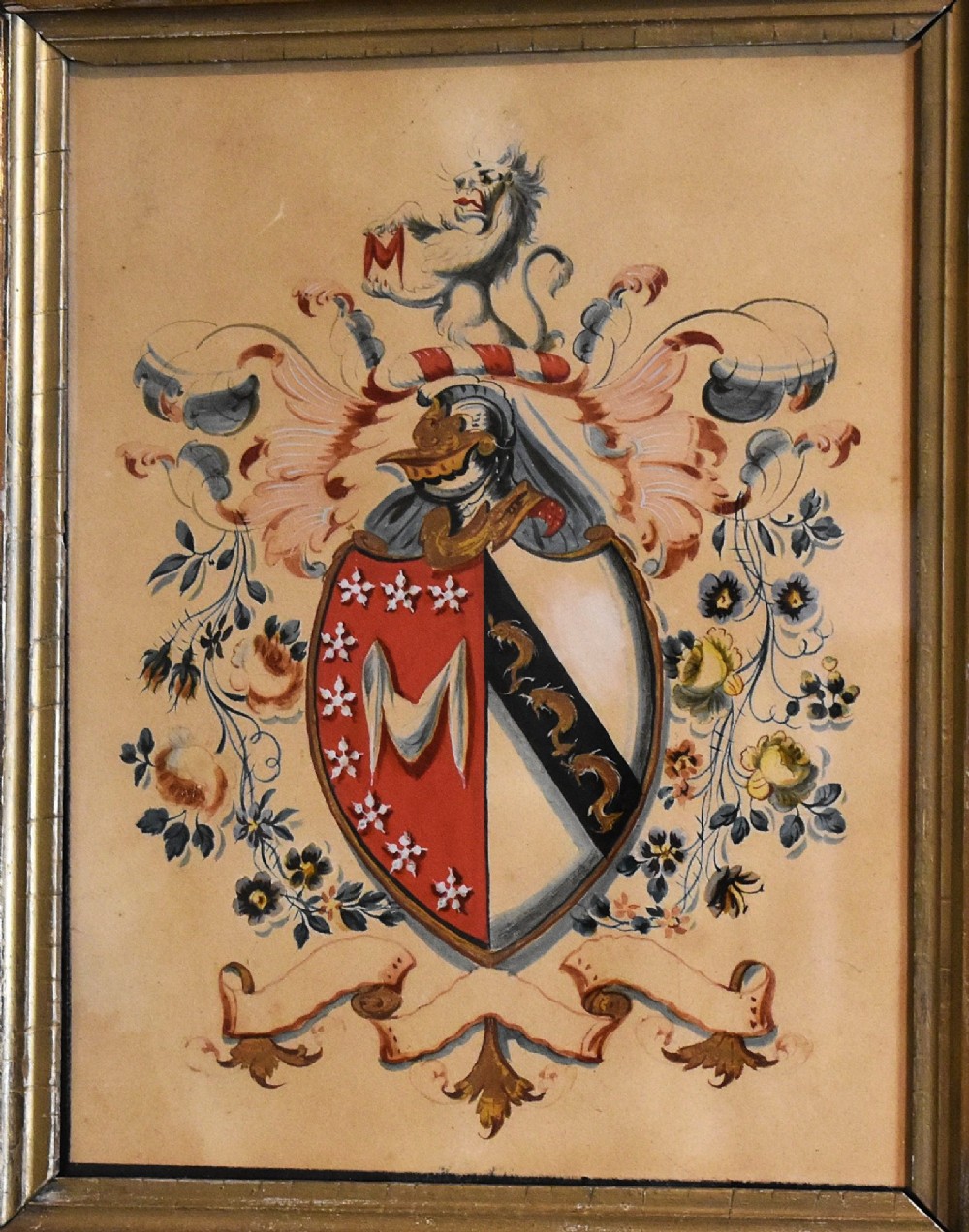 A framed nineteenth-century watercolour painting depicting an intricate heraldic coat of arms with a shield, crest, and floral flourishes inside a gilded wooden frame. View III