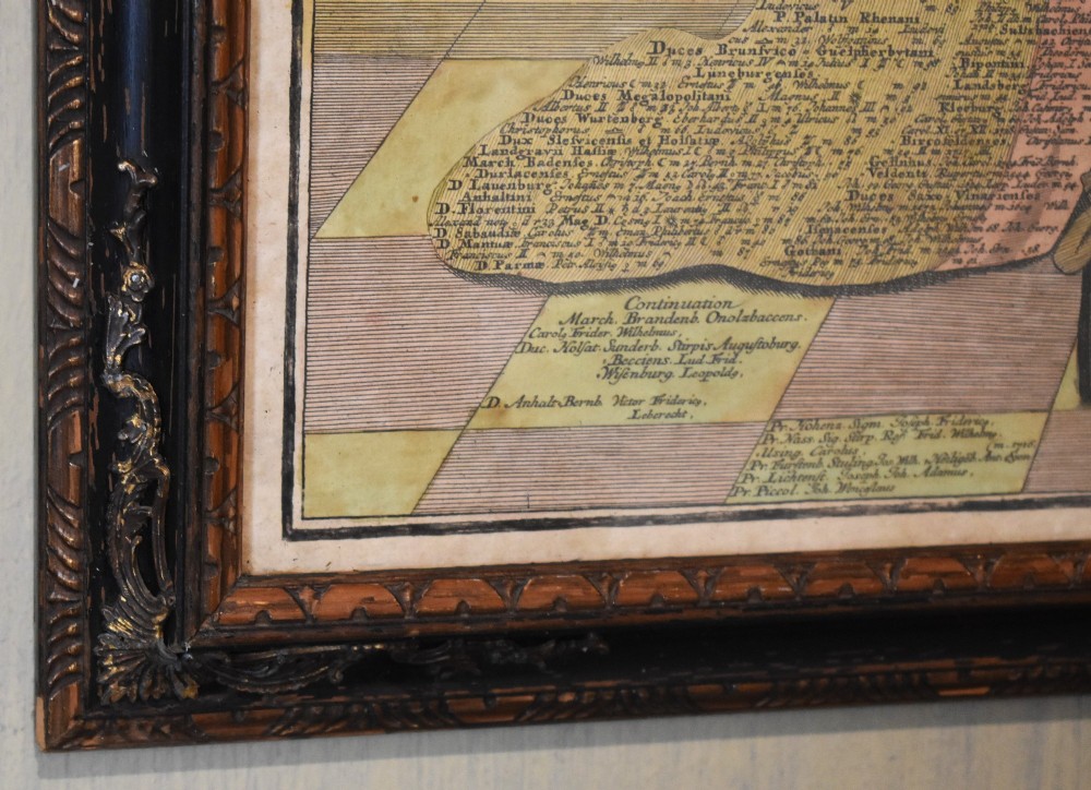 An 18th-century framed print featuring a standing figure in ceremonial robes alongside heraldic shields and Latin text. View VII