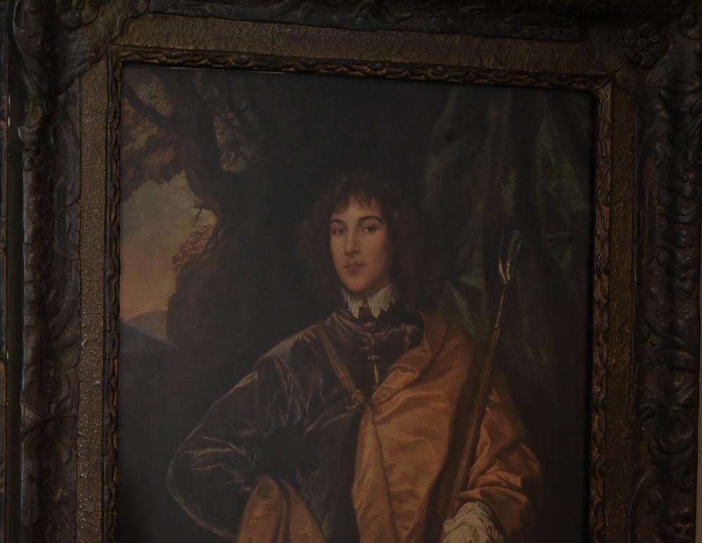 A framed portrait print depicting Philip, Lord Wharton, draped in an amber cloak against a dark background, set within a carved dark wood frame. View IV