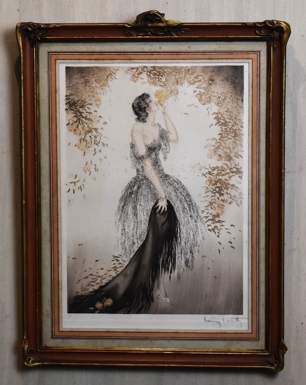A set of three framed Art Deco fashion prints by Louis Icart featuring figures in 1920s gowns, presented in two oval and one rectangular gilt frames. View III