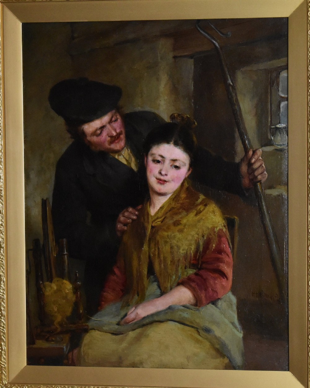 A 19th-century genre oil painting in an ornate gilt frame depicting a seated woman wearing a yellow shawl with a standing man behind her inside a rustic interior. View IV