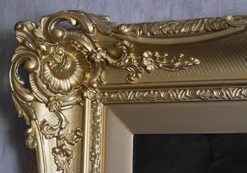 A 19th-century genre oil painting in an ornate gilt frame depicting a seated woman wearing a yellow shawl with a standing man behind her inside a rustic interior. View VII