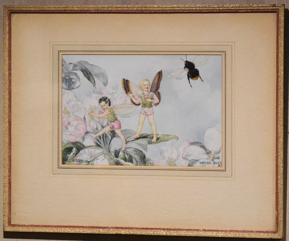 A framed watercolour painting titled Apple Blossom by Marjorie L Davies depicting two winged fairies and a bumblebee among apple blossoms. View II