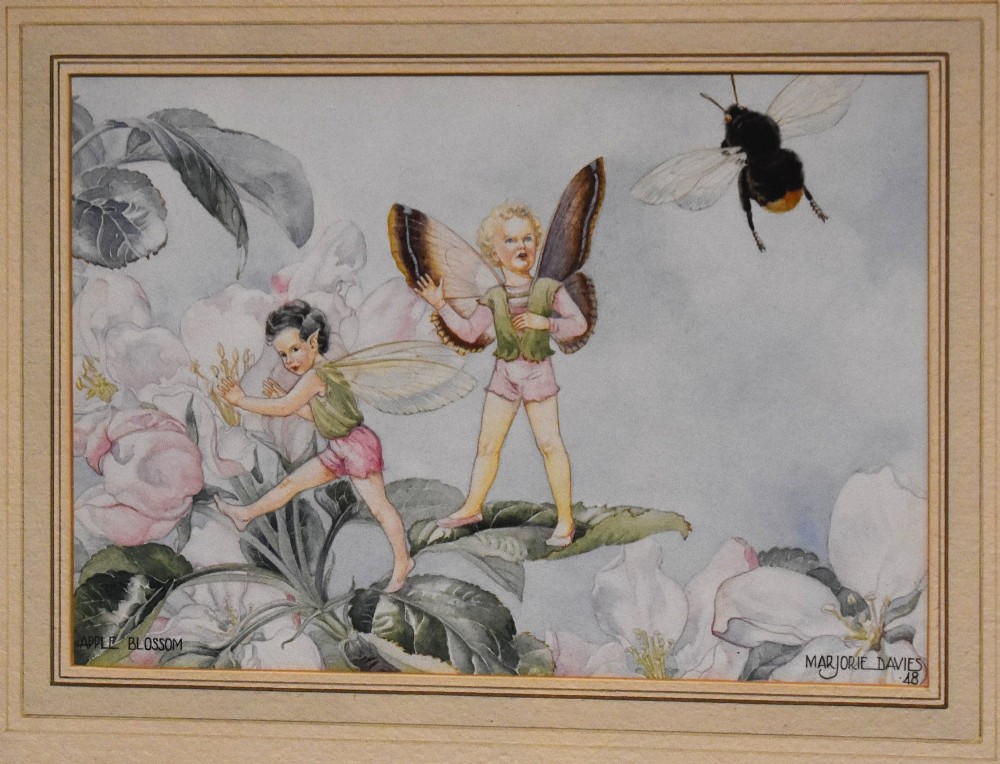 A framed watercolour painting titled Apple Blossom by Marjorie L Davies depicting two winged fairies and a bumblebee among apple blossoms. View III