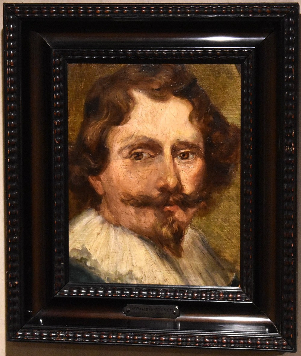 An oil painting portrait depicting a man with a moustache and white collar set within a dark moulded wood frame. View II