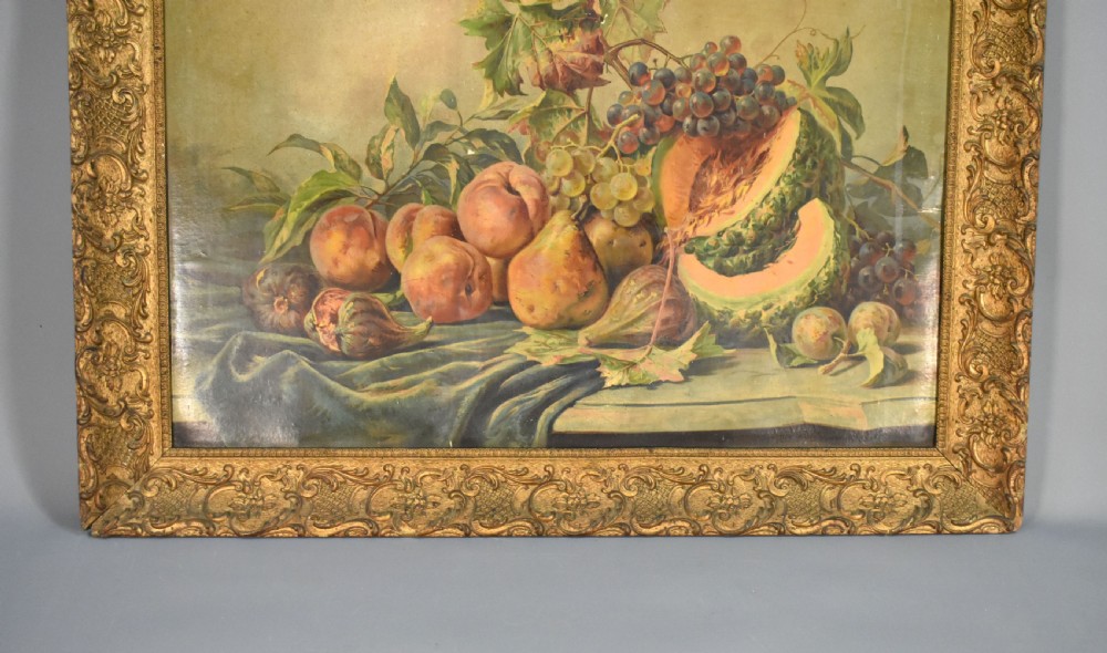 A large rectangular Louis XV style giltwood frame with detailed carved foliage mouldings framing a still life fruit painting. View V
