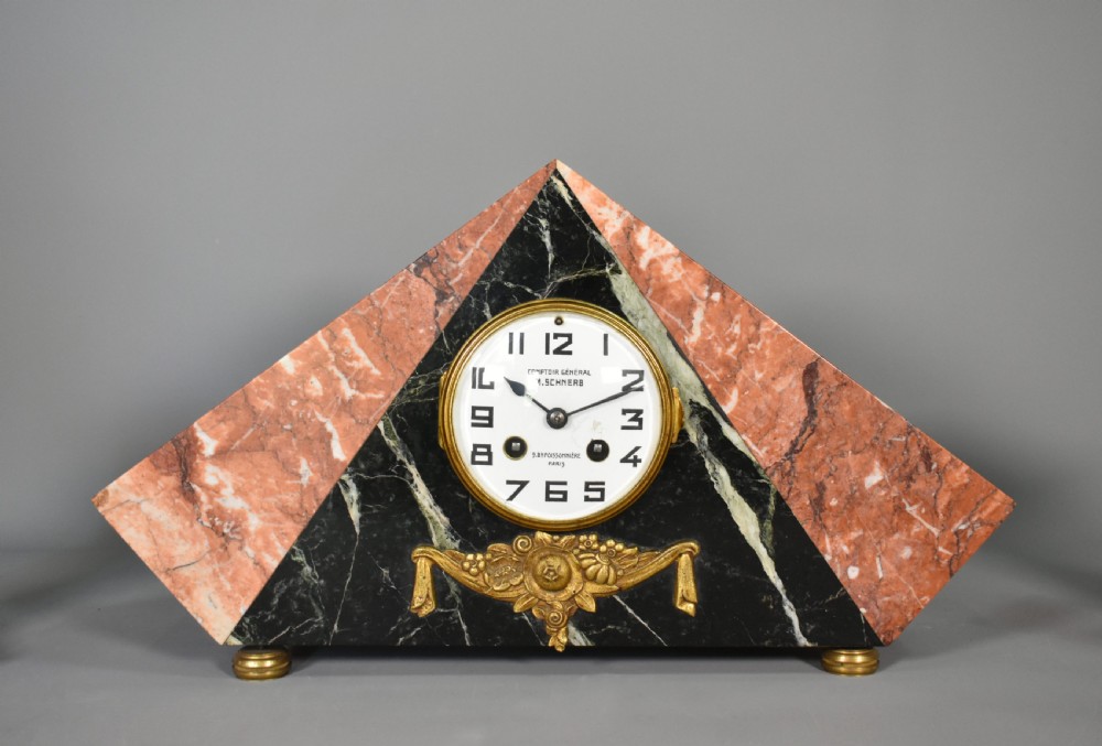 A French Art Deco three-piece clock set made from geometric pink and black veined marble with brass mounts. View IV