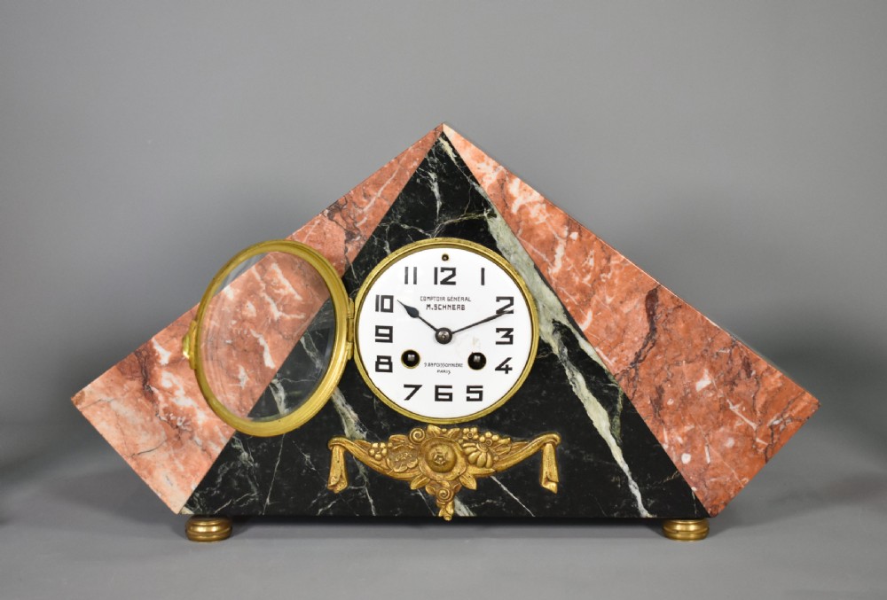 A French Art Deco three-piece clock set made from geometric pink and black veined marble with brass mounts. View VI