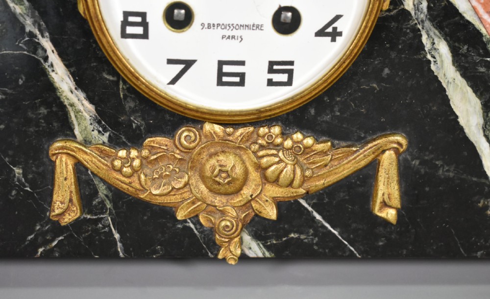A French Art Deco three-piece clock set made from geometric pink and black veined marble with brass mounts. View VII