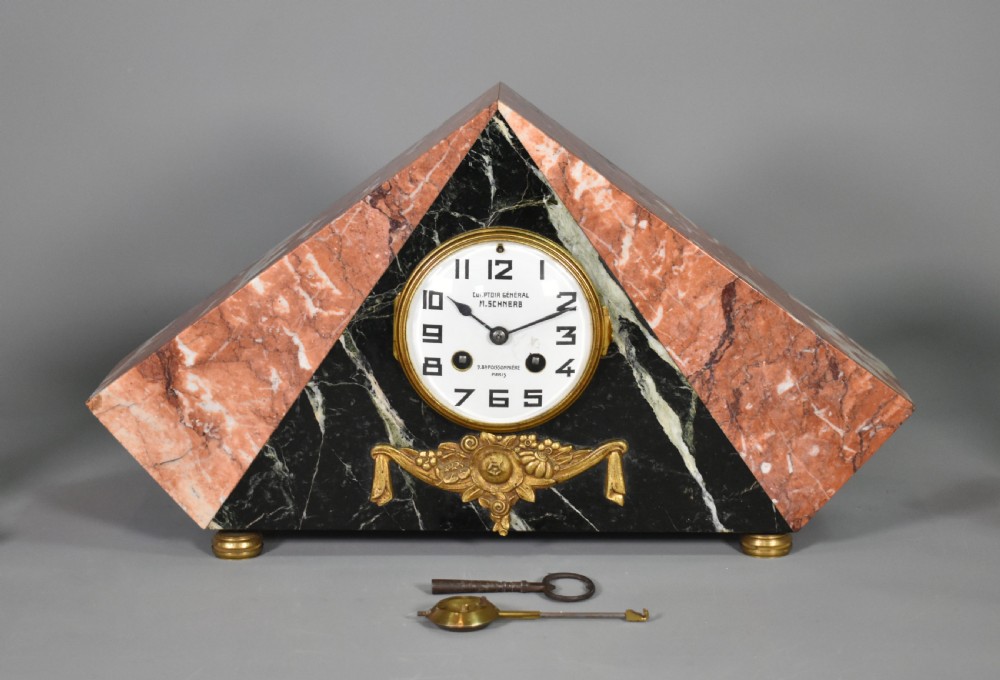 A French Art Deco three-piece clock set made from geometric pink and black veined marble with brass mounts. View X