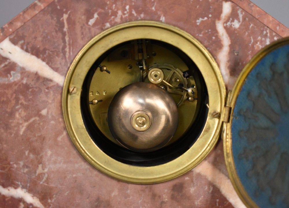 A French Art Deco three-piece clock set made from geometric pink and black veined marble with brass mounts. View XIII