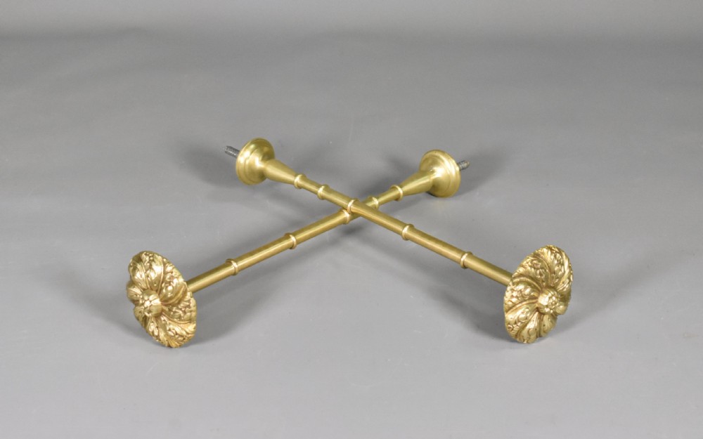 A pair of Second Empire French brass curtain tie-backs featuring circular carved floral rosettes on extended stems. View VI