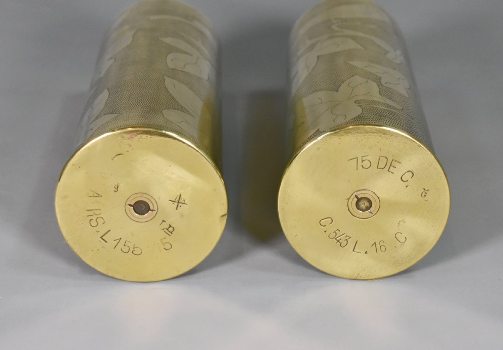 A pair of cylindrical brass artillery shell casing vases decorated with engraved birds and foliage on textured backgrounds. View XIV