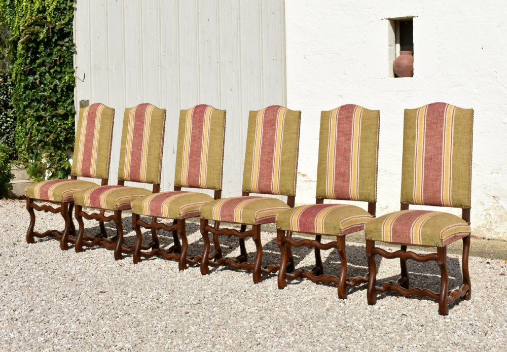 A set of six French Louis XIII style oak dining chairs featuring carved os de mouton legs and striped terracotta red and olive green upholstery. View II