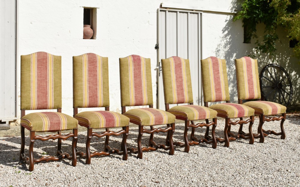A set of six French Louis XIII style oak dining chairs featuring carved os de mouton legs and striped terracotta red and olive green upholstery. View III