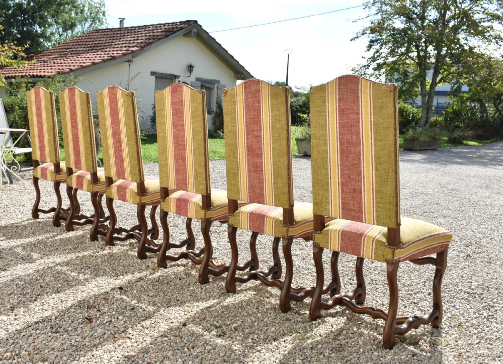 A set of six French Louis XIII style oak dining chairs featuring carved os de mouton legs and striped terracotta red and olive green upholstery. View VIII