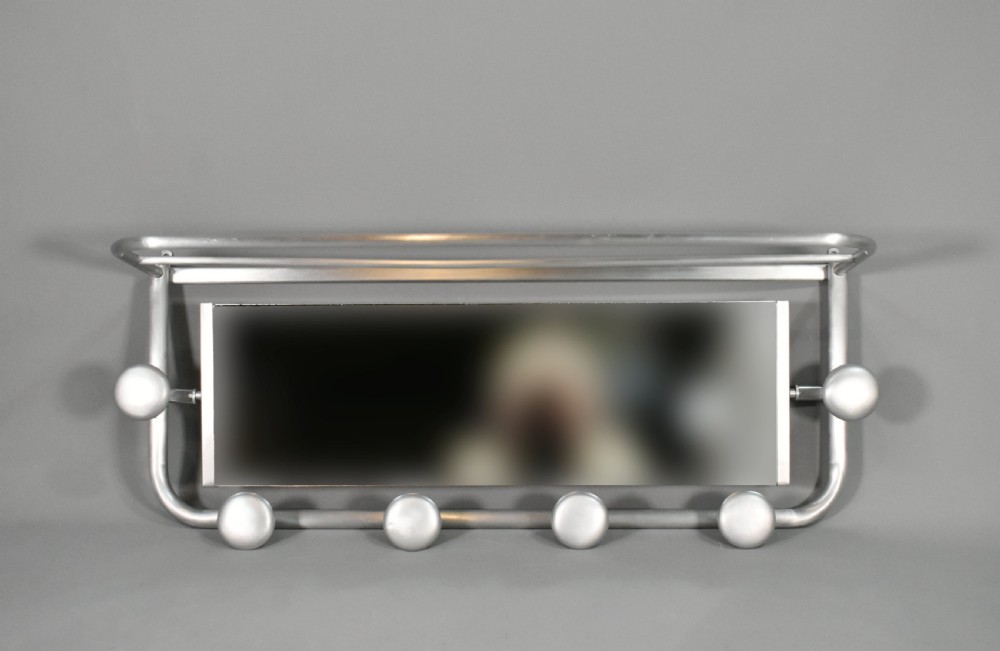 A French Art Deco wall-mounted tubular aluminium coat and hat rack featuring a central rectangular mirror, top slatted shelf, and spherical pegs. View IV