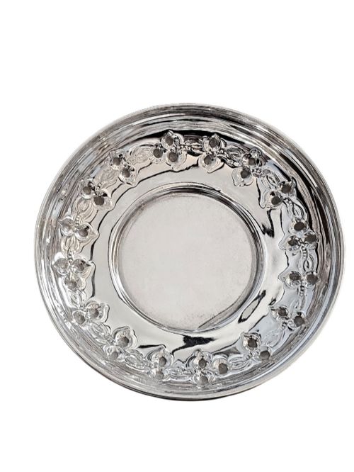 fig 1. A small circular Edwardian sterling silver dish featuring a polished central well and a decorative pierced rim with geometric cut-outs.