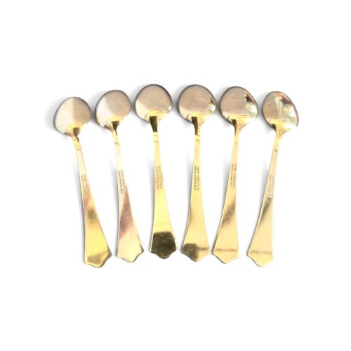 fig 1. Set of six sterling silver gilt coffee spoons featuring white guilloche enamel flared handles.