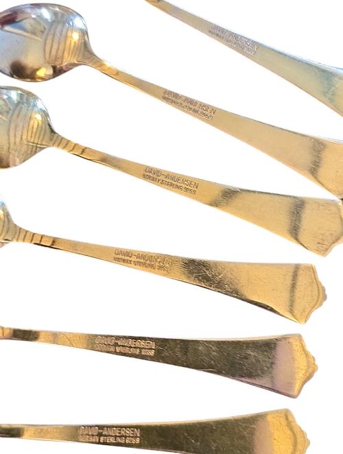 fig 2. Set of six sterling silver gilt coffee spoons featuring white guilloche enamel flared handles.