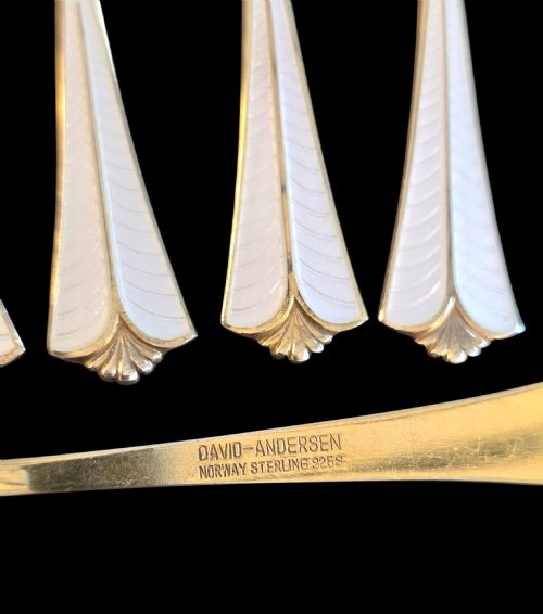fig 3. Set of six sterling silver gilt coffee spoons featuring white guilloche enamel flared handles.