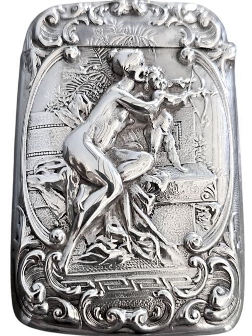 fig 5. An Edwardian sterling silver vesta case featuring embossed relief detailing of Cupid and Psyche framed by scrollwork borders.