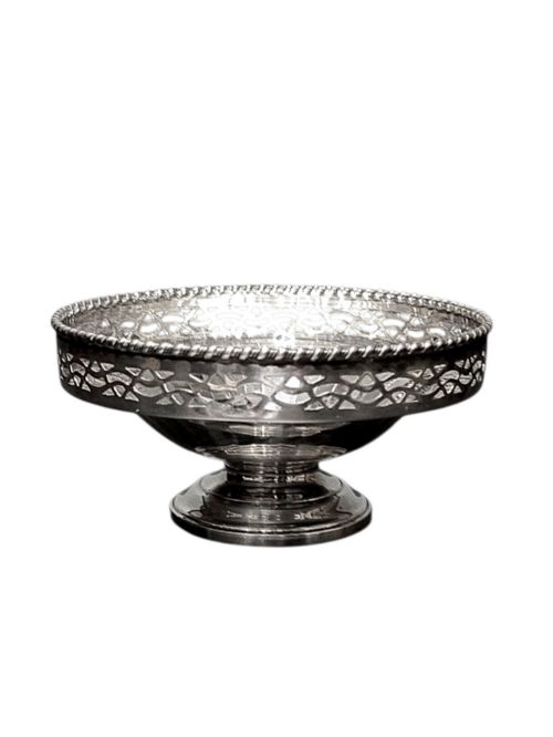 fig 1. A circular sterling silver pedestal bonbon dish featuring a pierced lattice border, beaded rim, fluted interior, and round stepped foot.