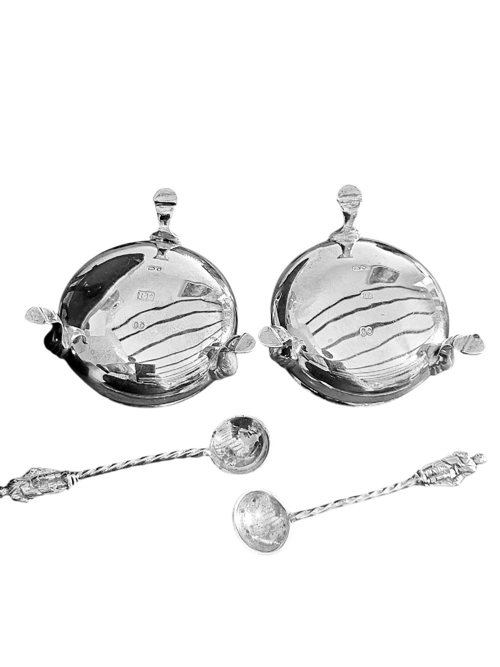 A pair of Victorian sterling silver open salt cellars featuring beaded rims, cabriole legs, cobalt blue glass liners, and matching silver salt spoons. View III