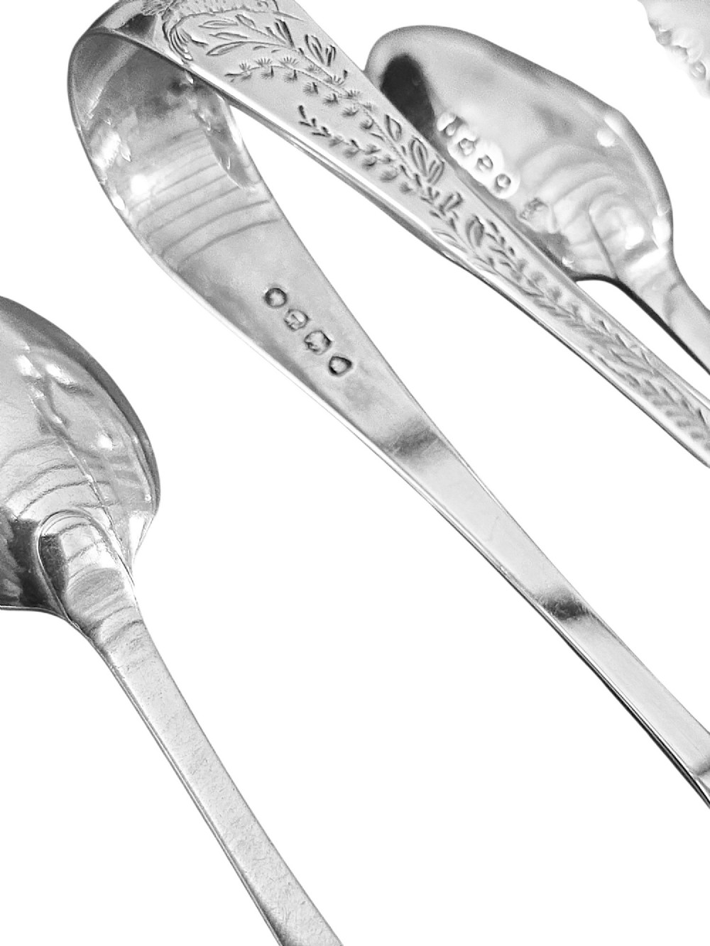 Set of six Victorian sterling silver teaspoons and matching sugar tongs featuring engraved bird and foliate motifs. View IV