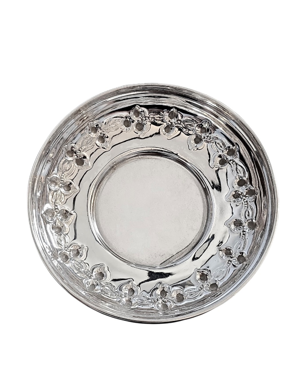 A small circular Edwardian sterling silver dish featuring a polished central well and a decorative pierced rim with geometric cut-outs. View II