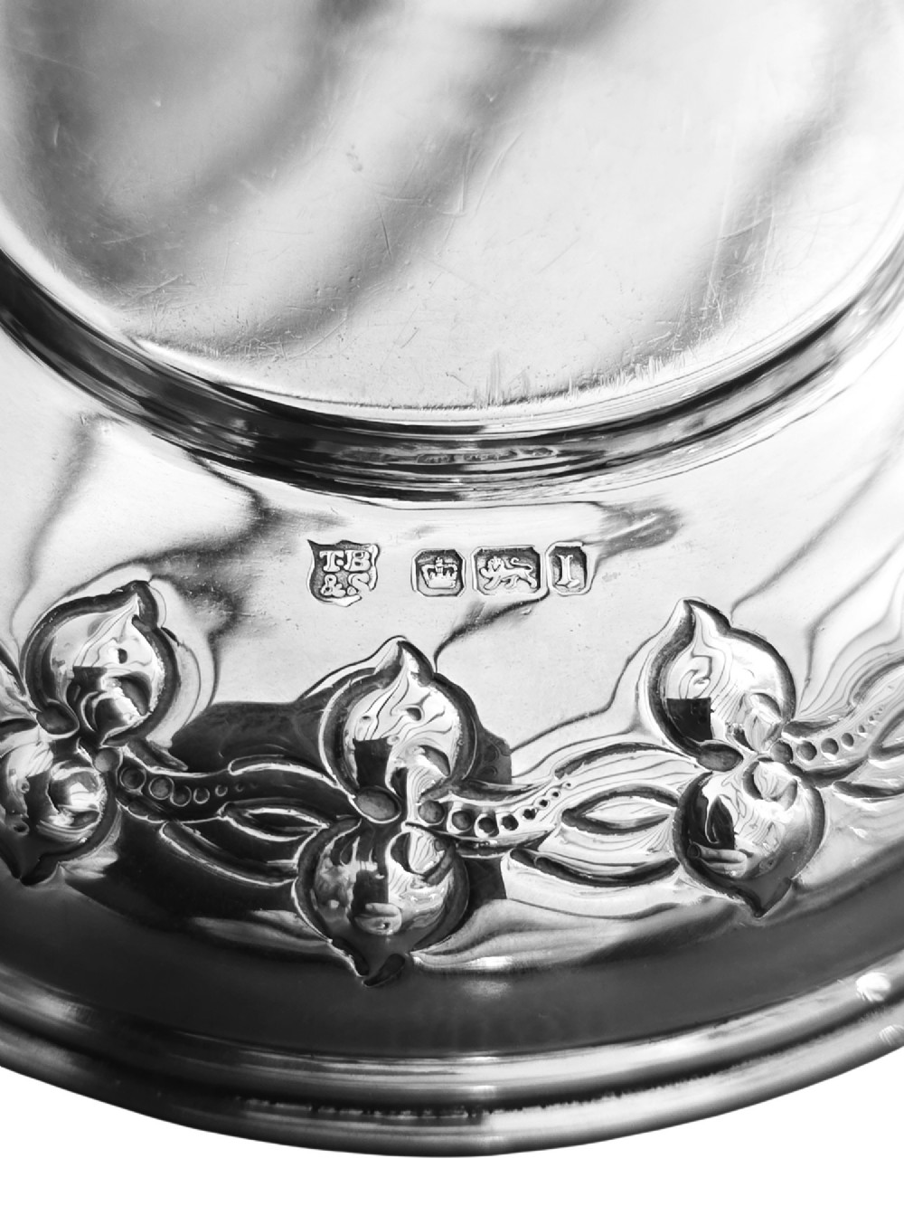 A small circular Edwardian sterling silver dish featuring a polished central well and a decorative pierced rim with geometric cut-outs. View IV