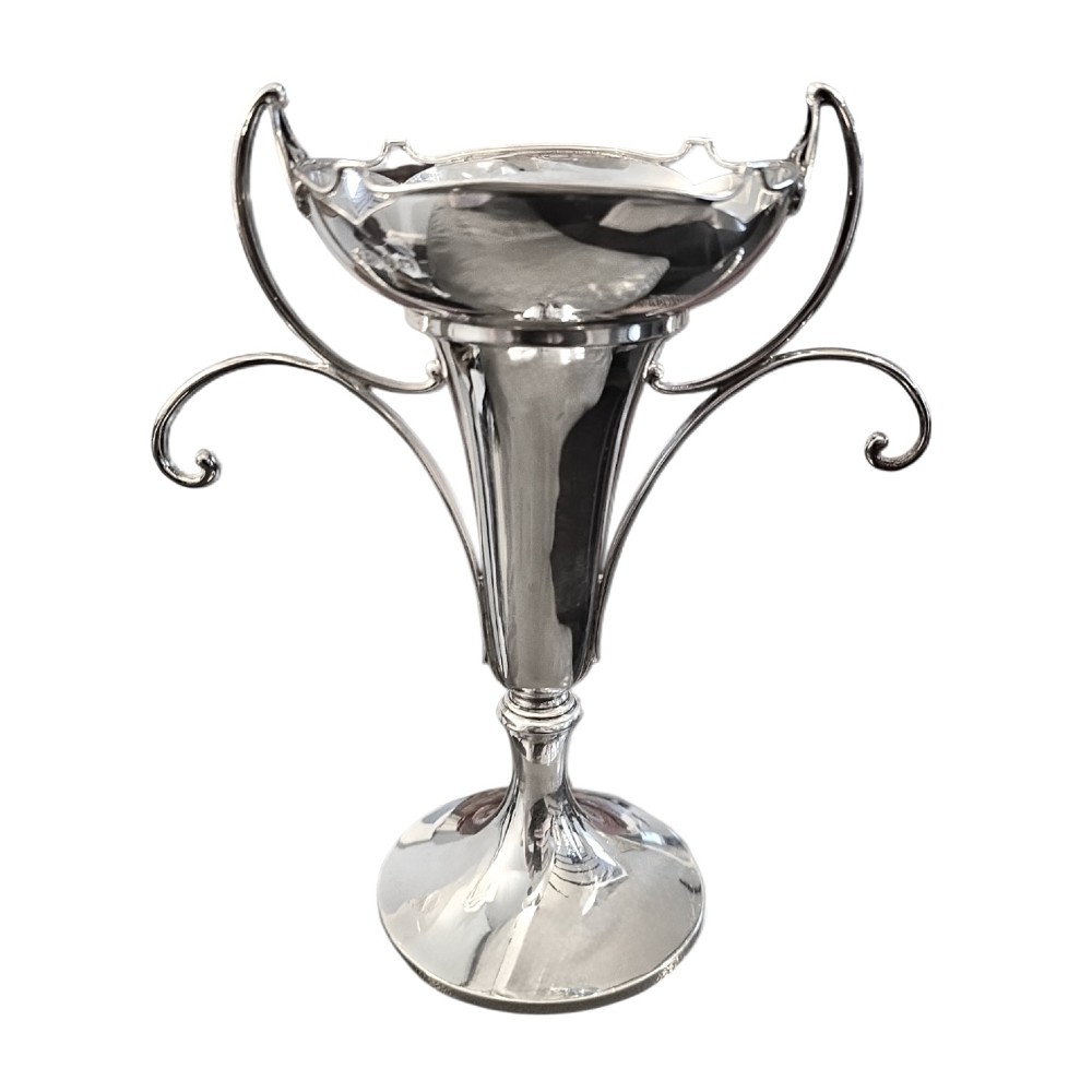 An antique sterling silver Art Nouveau vase with sweeping scroll handles, a shaped rim, and a circular pedestal base.