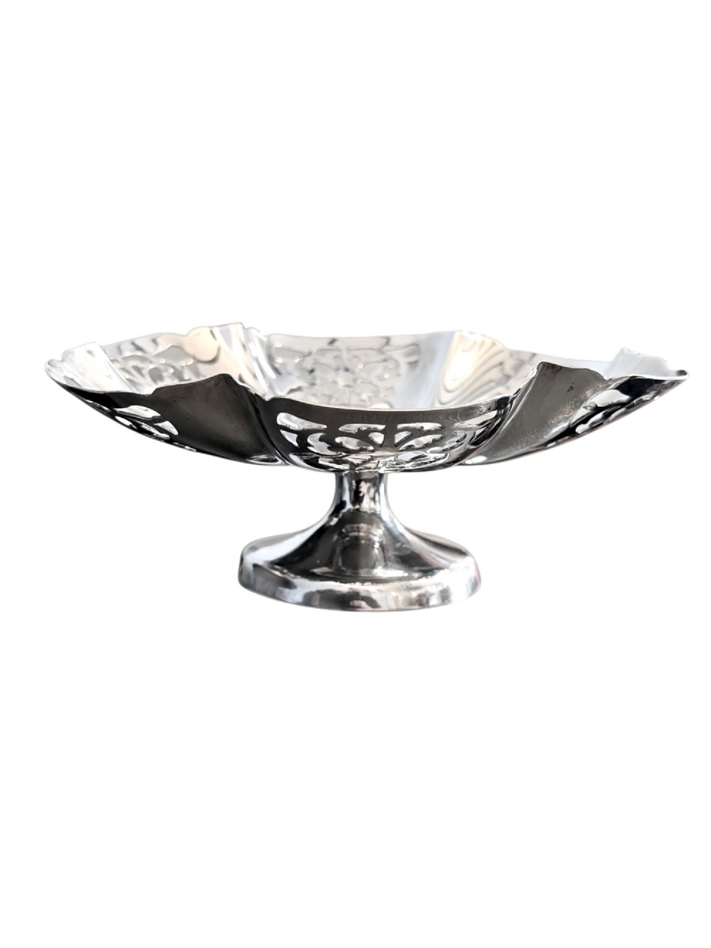 A hallmarked sterling silver bonbon dish featuring a pierced scalloped rim and a short pedestal foot.