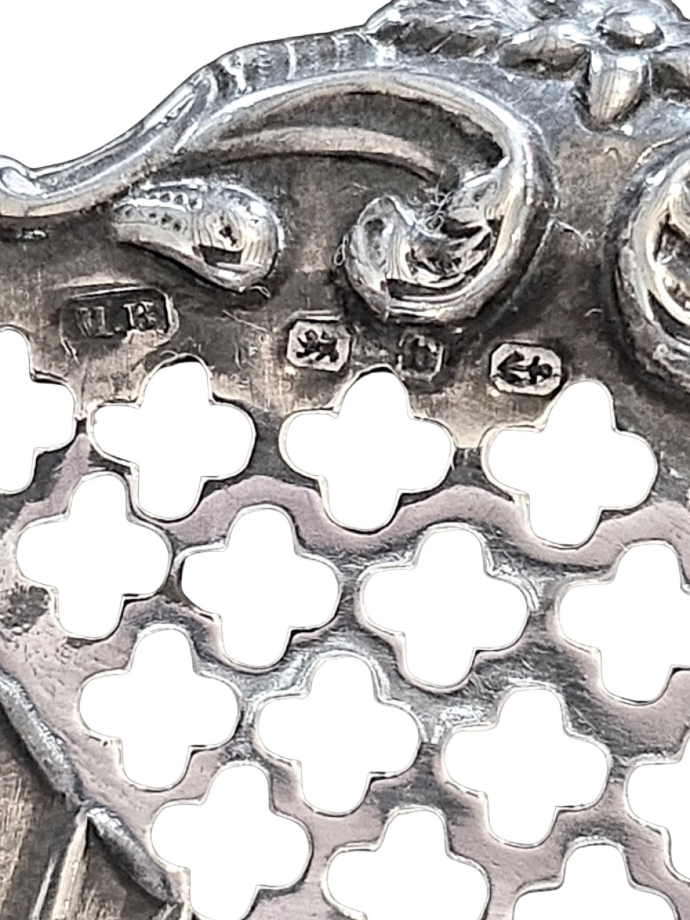 A pair of late Victorian sterling silver bonbon dishes with pierced lattice rims and scrolled edges. View III