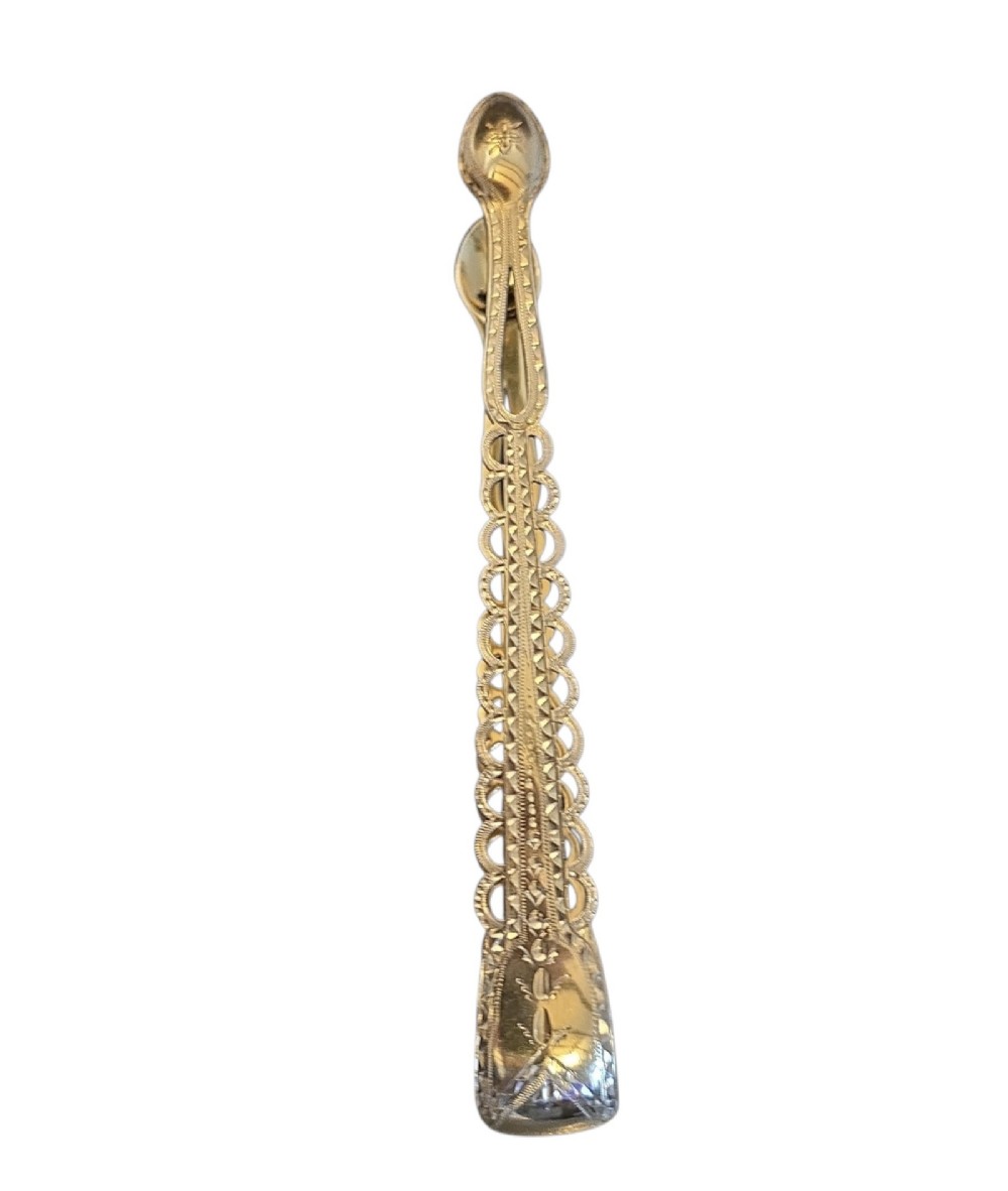 A pair of Victorian silver-gilt sugar tongs featuring decorative pierced arms and engraved spoon-shaped ends. View IV