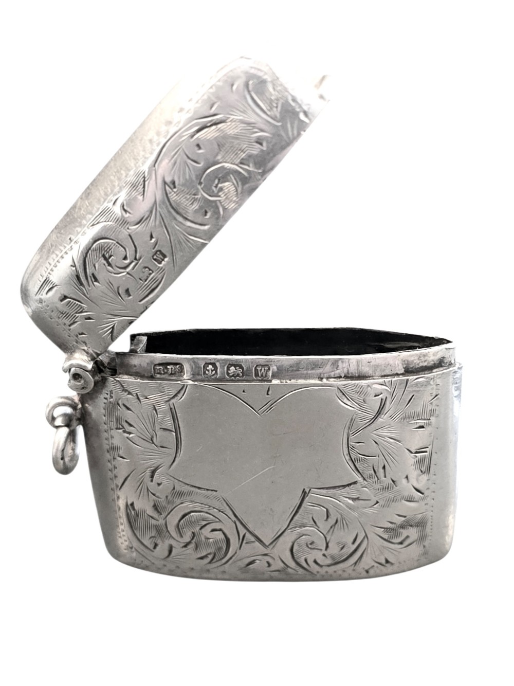 A small rectangular sterling silver vesta case with hand-engraved scrollwork, a central vacant shield cartouche, and a side suspension ring. View IV