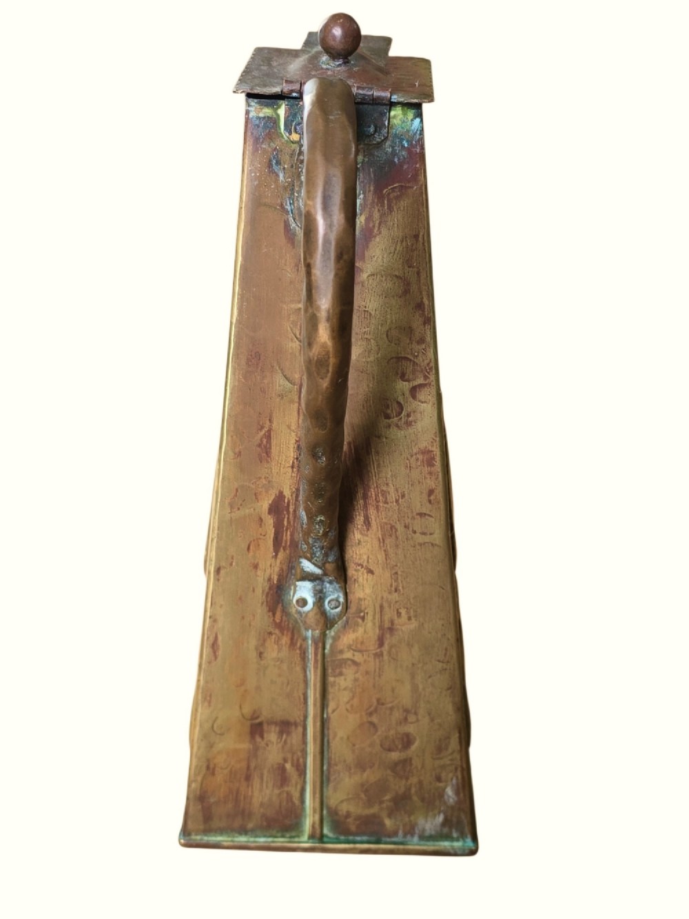 A tapered square brass water jug with a fitted metal lid, curved handle, and embossed stylised Art Nouveau motifs on the sides. View V