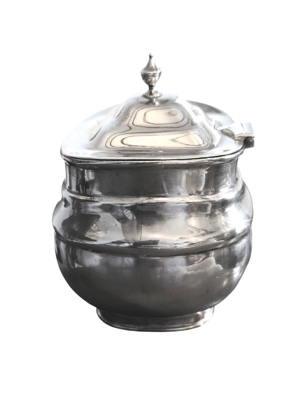 An Edwardian sterling silver tea caddy featuring a bulbous body, stepped lid, and urn-shaped finial. View II