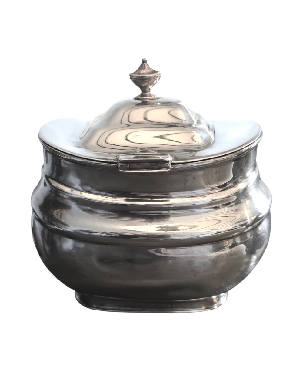 An Edwardian sterling silver tea caddy featuring a bulbous body, stepped lid, and urn-shaped finial. View III