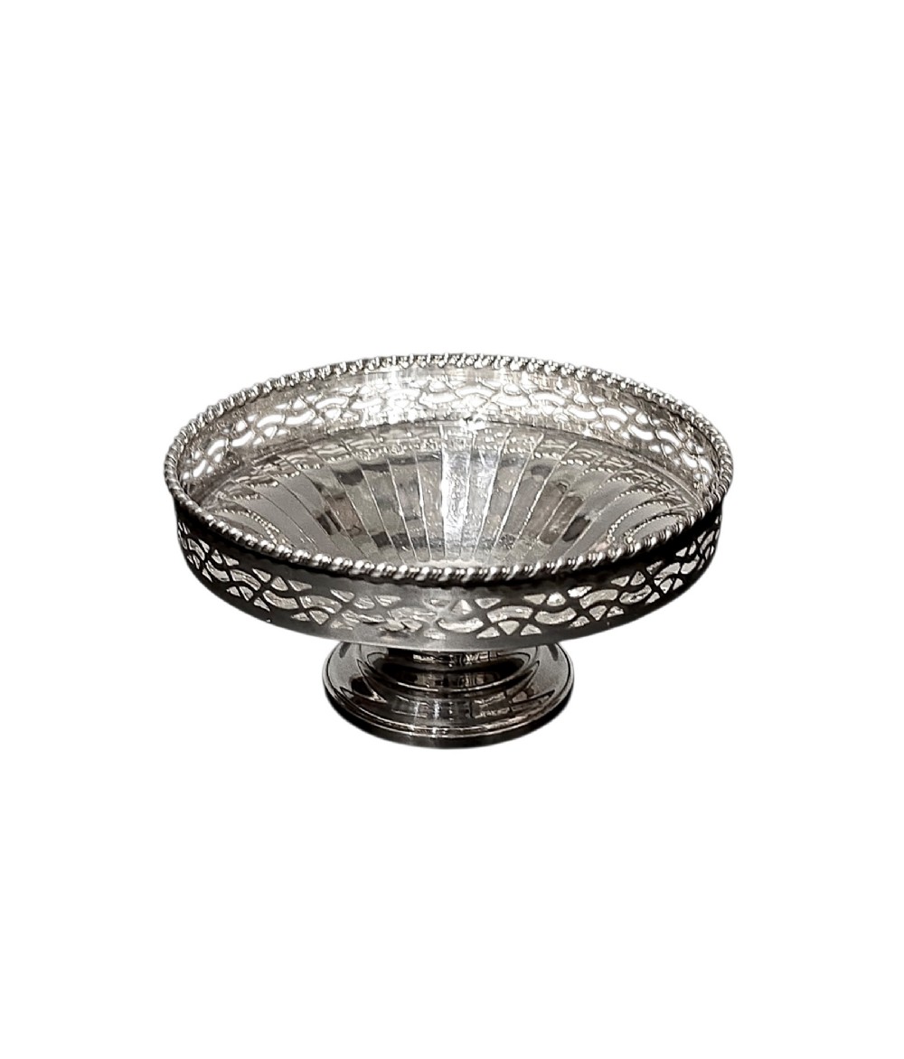 A circular sterling silver pedestal bonbon dish featuring a pierced lattice border, beaded rim, fluted interior, and round stepped foot.